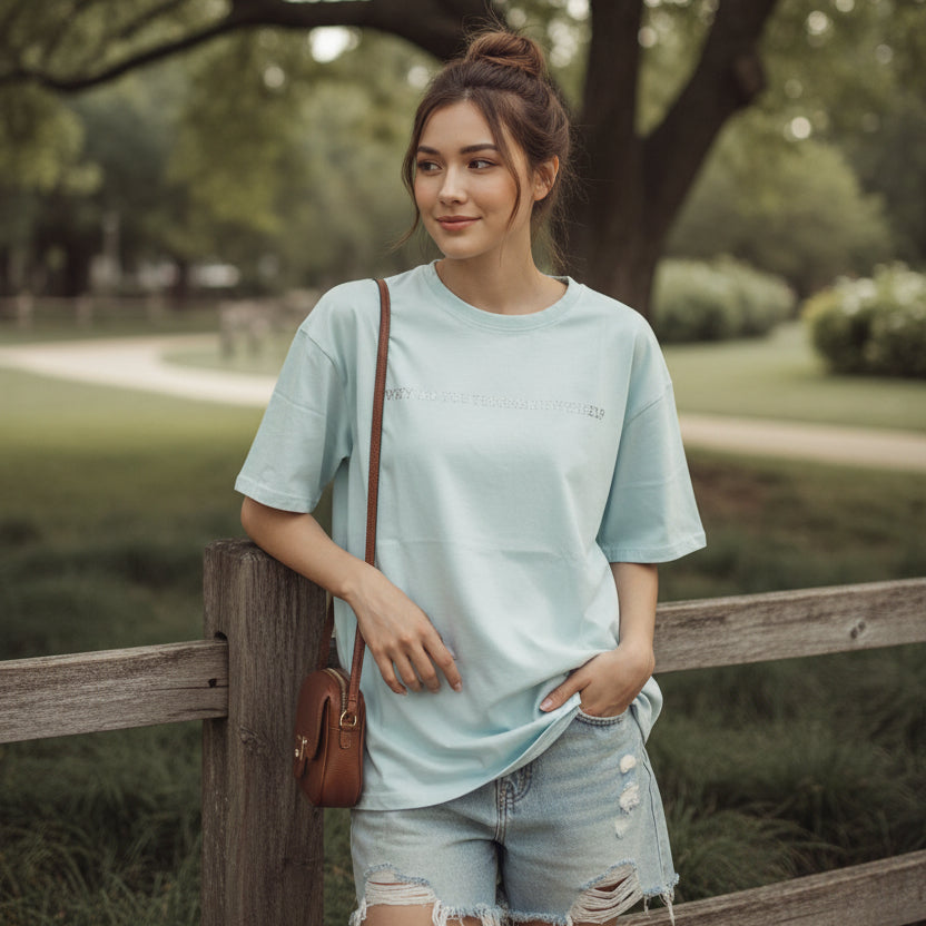 Woman wearing a light blue tshirt outdoors in nature