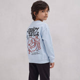 Boy looking over his shoulder showing the graffiti smiley back print