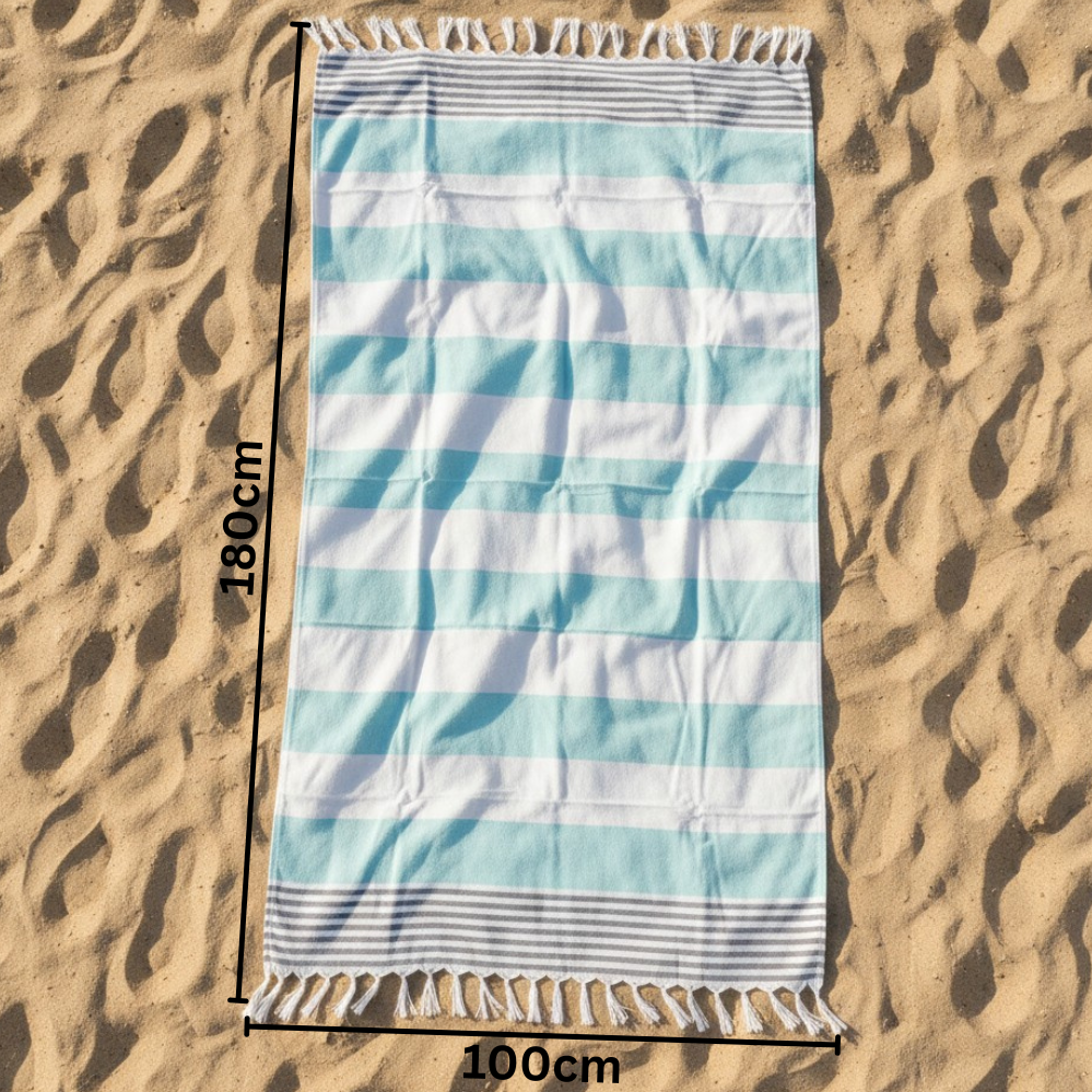 Striped beach towel on sand with dimensions indicated
