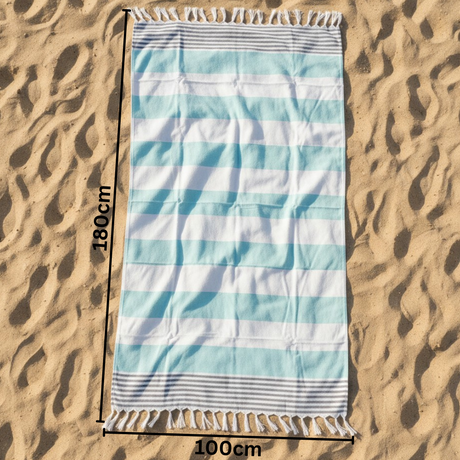 Striped beach towel on sand with dimensions indicated