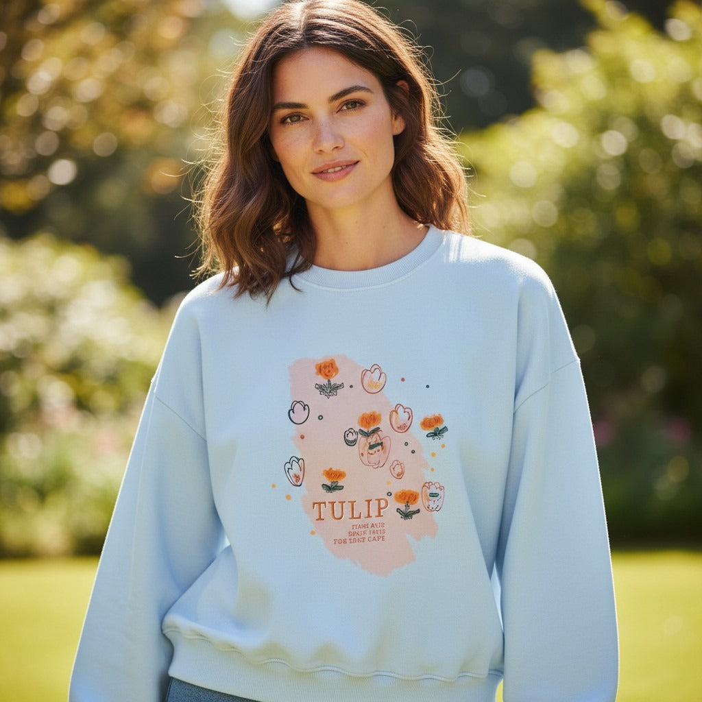 Woman in light blue sweatshirt with a hand drawn tulip print panel, Jack Gifts Online Lebanon