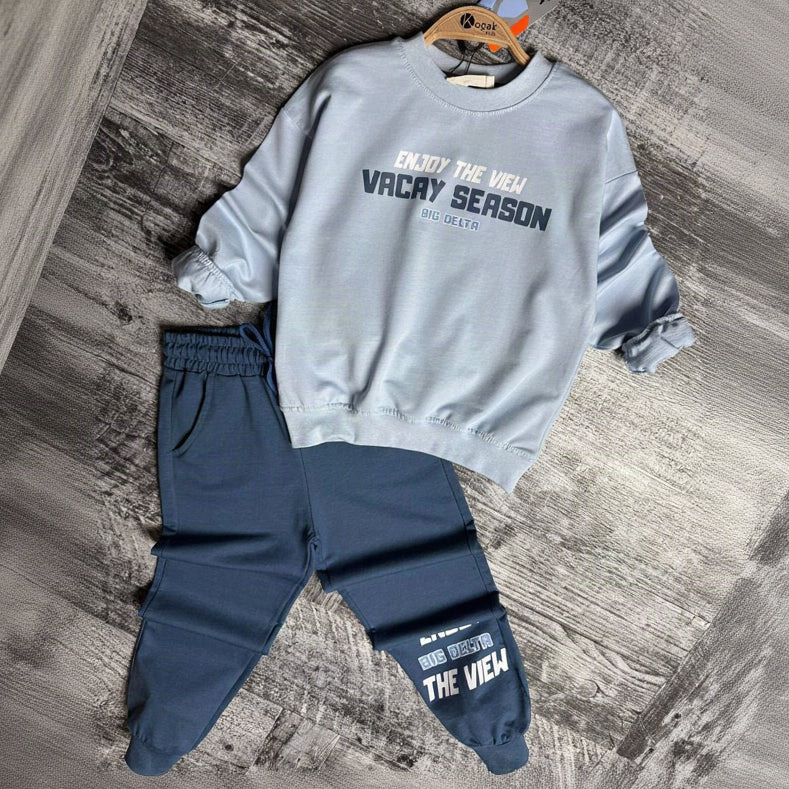 Light blue Vacay Season sweatshirt and denim joggers on a hanger