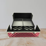 Pink aluminium vanity case open to show empty black cantilever trays on silver arms