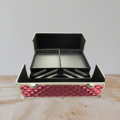 Pink aluminium vanity case open to show empty black cantilever trays on silver arms
