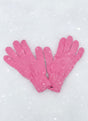 Pair of plain light pink knitted kids gloves on fresh snow