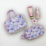 Light purple floral cosmetics bags with bottles on a light background