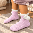 Lilac fuzzy kids socks with a white cuff and soft white angel wings at the ankle