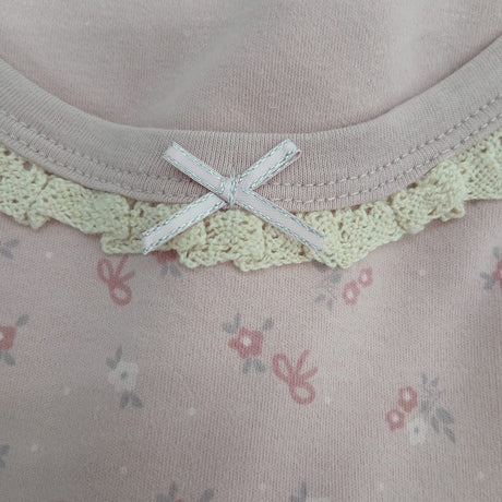 Lace trim neckline with a small bow on lilac floral pointelle