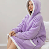 Ribbed cuffs and a broad white sherpa border round the hood, hem and pocket of a lilac blanket