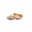 Lilac ribbed enamel hoop earring with gold finish on a white background