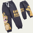 Flat lay of charcoal grey lion cub joggers showing the white drawstring waist and ribbed cuffs