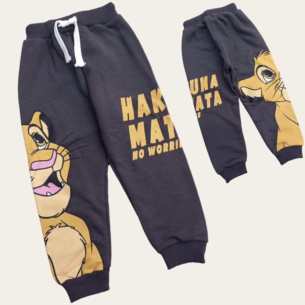 Flat lay of charcoal grey lion cub joggers showing the white drawstring waist and ribbed cuffs
