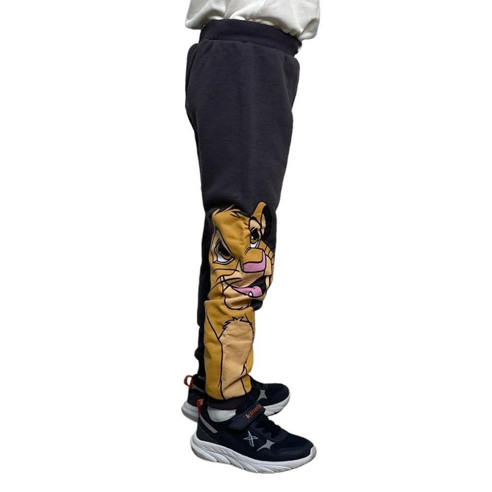 Side view close up of the lion cub face printed down the leg of charcoal grey cotton joggers