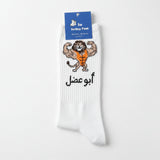 White sock with cartoon lion design and text on a white surface