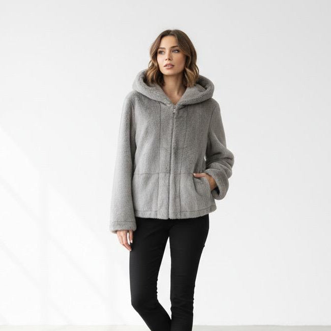 Woman trying on a long grey faux fur hooded jacket in store, Jack Gifts Online Lebanon