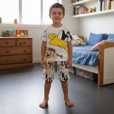 White boys set with a yellow Daffy Duck tee and shorts covered in Taz and Sylvester faces