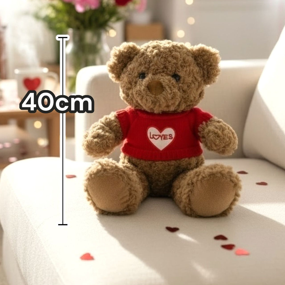 Golden brown bear in the red heart jumper surrounded by foil heart confetti