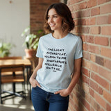 Light blue slogan tee worn against an exposed brick wall
