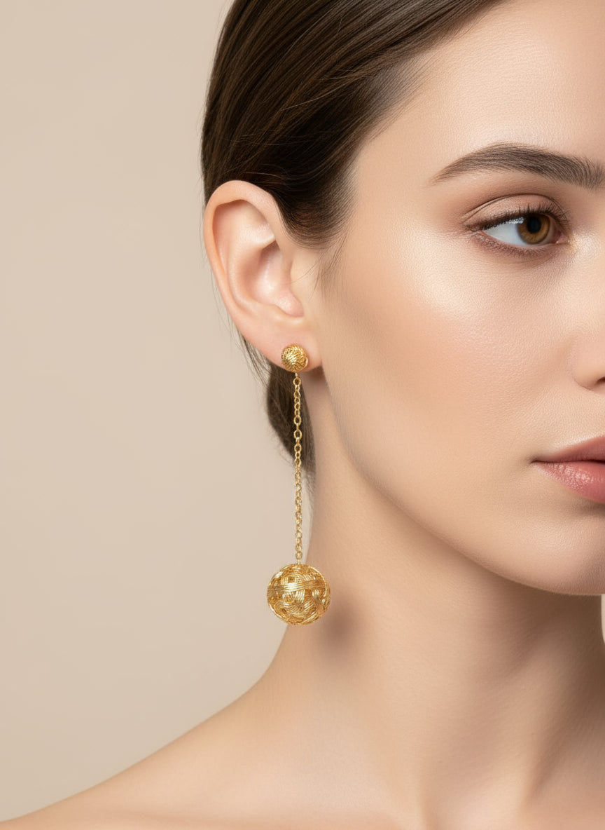 Woman wearing luxe affair earring on a beige background