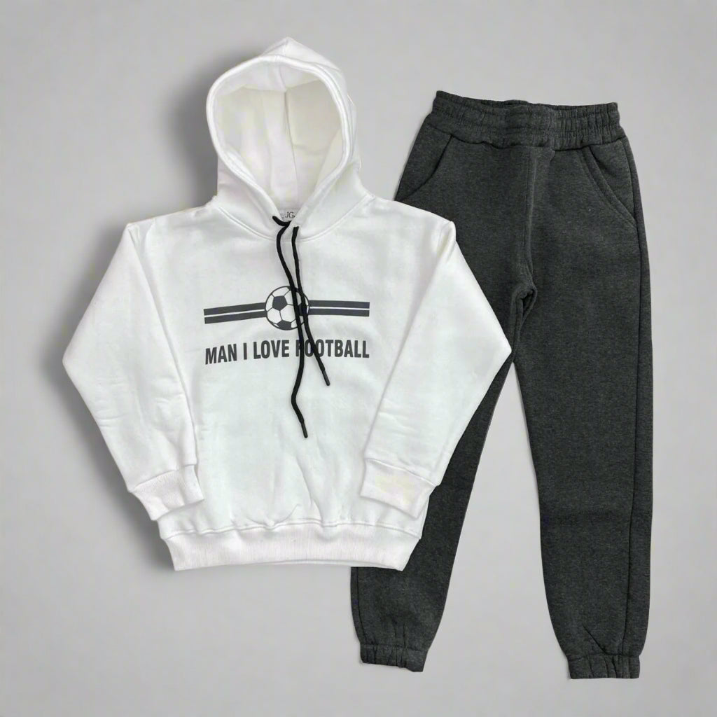 White hoodie with a football badge print laid out with charcoal joggers