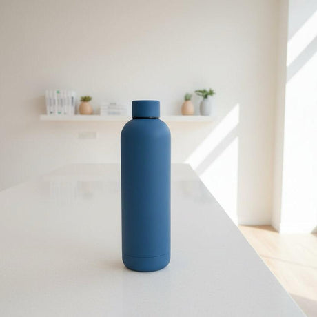 Slate blue matte 750ml insulated bottle on a light countertop