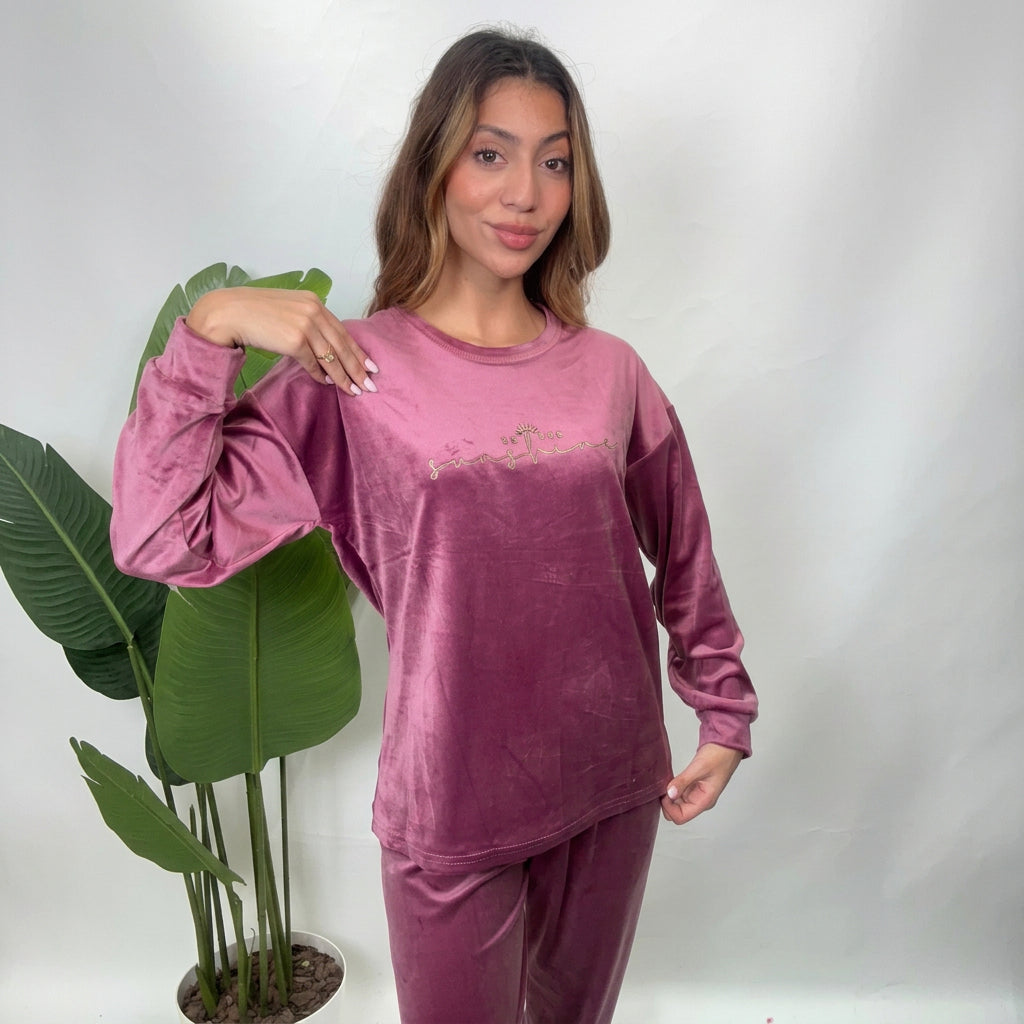 Mauve pink velvet pajama top with silver Be The Sunshine script, styled with a hand on her shoulder