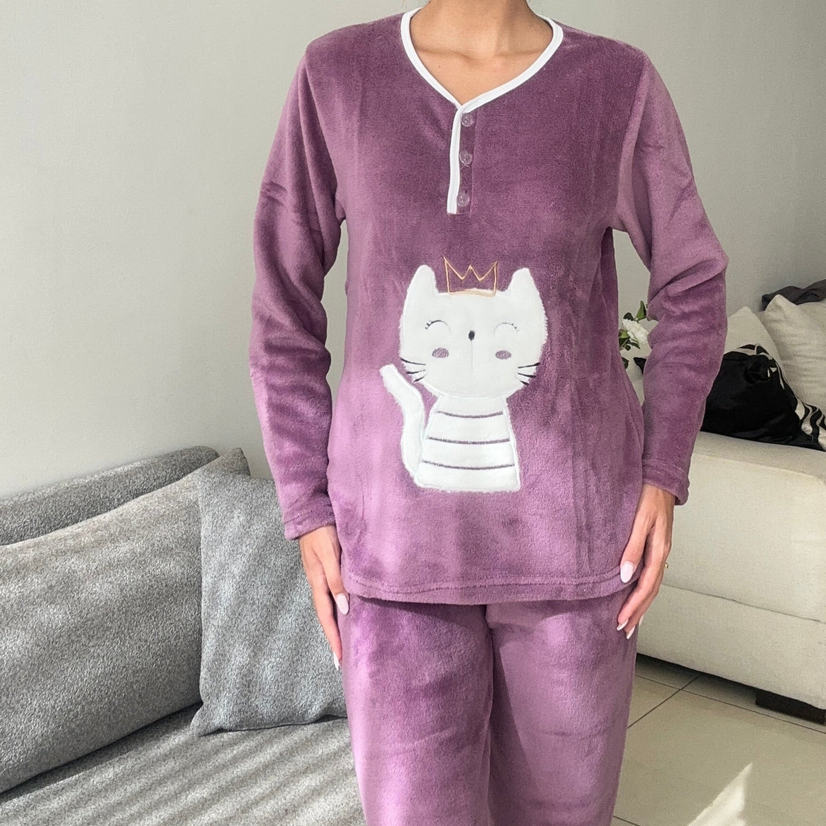 Close view of the mauve pyjama top showing the button placket and applique detail