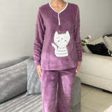 Mauve fleece pyjama set with a white crown cat applique and white piped button neck