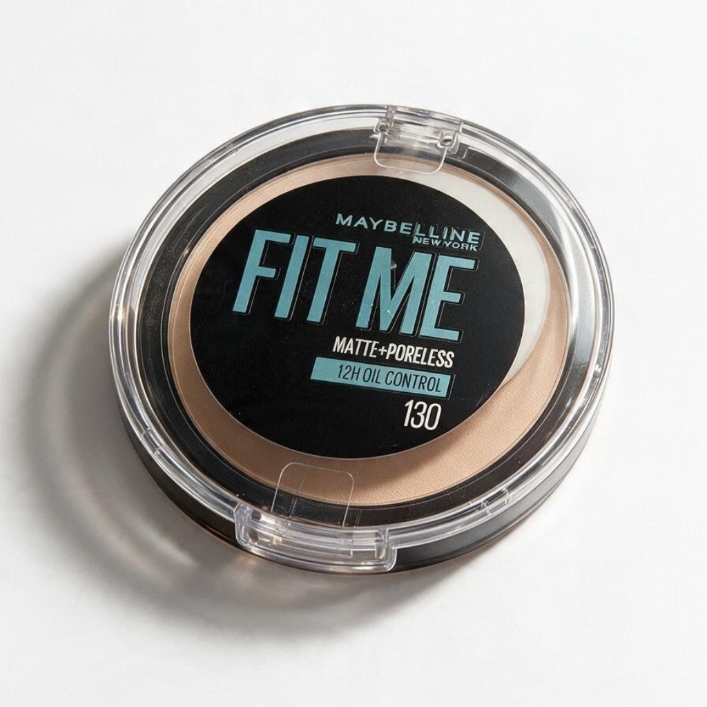 Maybelline Fit Me Matte Poreless pressed powder in shade 130, a compact on a white surface with a soft shadow