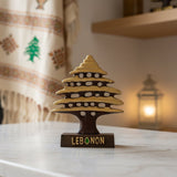 Gold and brown cedar tree statue with pierced branch tiers on a wooden Lebanon base