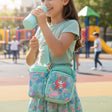 Girl carrying a mint mermaid crossbody bag with bottle holder, Jack Gifts Online Lebanon