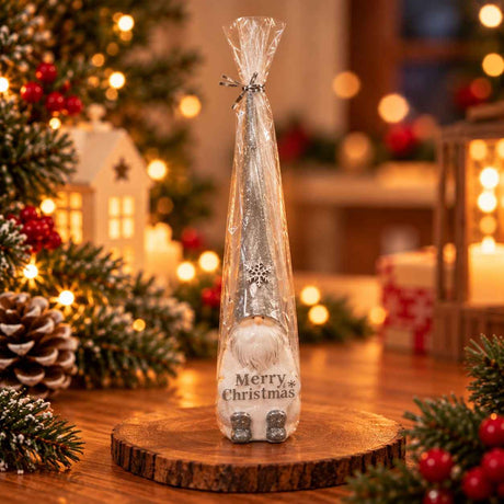 Silver glitter gnome ornament with a white beard and Merry Christmas lettering