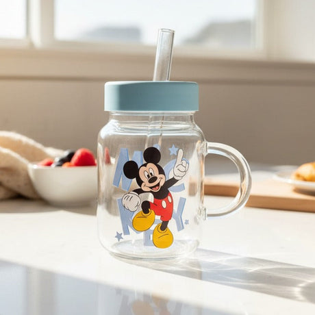 Clear glass jar mug with a blue lid, glass handle and a Mickey decal with a star print