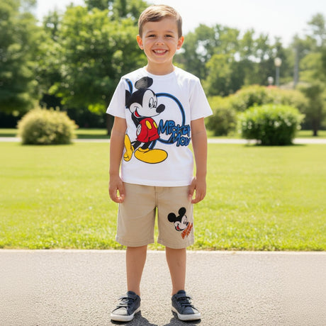 White boys set with a classic Mickey Mouse graphic tee and beige shorts, worn outdoors