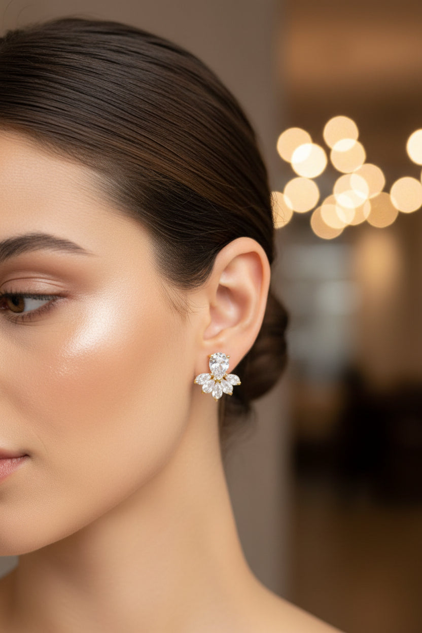 Close-up of a woman wearing a silver earring with a blurred background