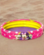 Pink and yellow three ring kids pool with polka dots and cartoon mouse and kitten artwork