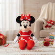 Seated mouse plush in a red polka dot dress with a matching bow between its ears
