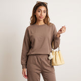 Close view of the mocha sweatshirt ribbed crew neckline and elastic waist sweatpants