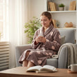 Girl reading in an armchair wearing a mocha robe with pink polka dots