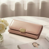 Soft toned women's wallet with an elegant gold clasp