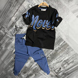 Black tee with a blue Move script print and blue cuffed cargo joggers laid flat