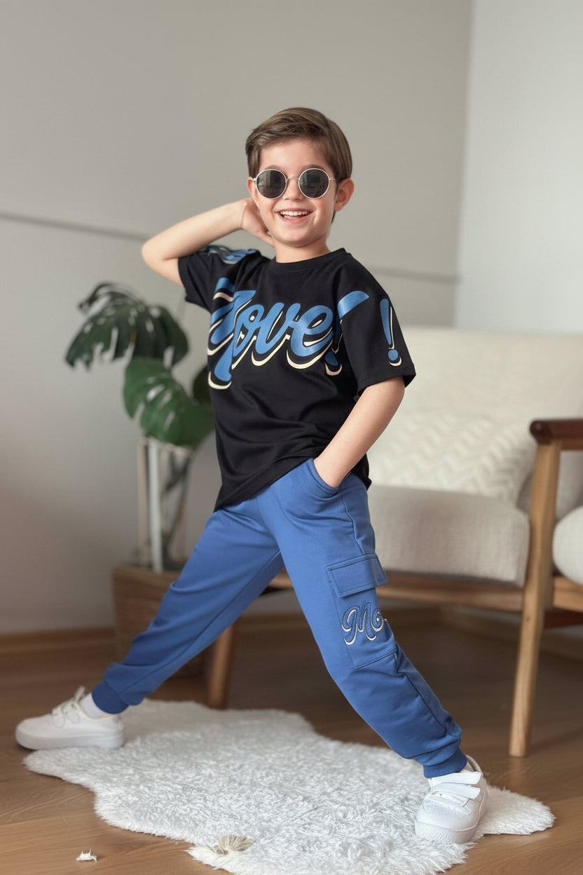Boys set with a black Move slogan tee and blue cargo joggers, worn with white sneakers