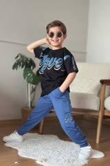 Boys set with a black Move slogan tee and blue cargo joggers, worn with white sneakers