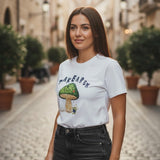 Woman wearing a white t-shirt with a mushroom on a cobblestone street