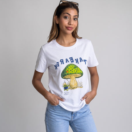 White tee with a large mushroom illustration, worn with blue jeans