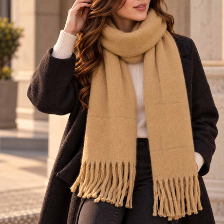 Warm mustard blanket scarf looped at the neck with long twisted tassels