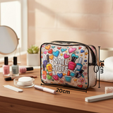 Cosmetic bag with 'Nail Stuff' design on a wooden table with nail polish and tools.