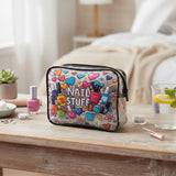 Colorful nail art case on a wooden table with a bedroom background