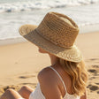 Natural crochet straw hat with a thin braided cord band above the brim