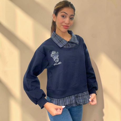 Check collar held up at the neckline of a navy brushed fleece sweatshirt